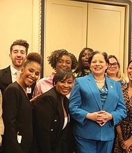 During a private gathering prior to Rep. Jennifer L. McClellan’s official swearing-in ceremony, she poses for a group photo with her new Congressional staff, many of whom served on the late Rep. A. Donald McEachin’s staff.