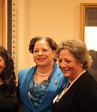 Rep. Jennifer L. McClellan, center, pauses for a photo with her sisters, Julie McClellan of Midlothian, left, and Jean McClellan-Holt of Chesapeake.