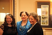 Rep. Jennifer L. McClellan, center, pauses for a photo with her sisters, Julie McClellan of Midlothian, left, and Jean McClellan-Holt of Chesapeake.