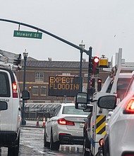 A flooding sign on the Embarcadero during a rain storm in San Francisco, California, on Thursday.
Mandatory Credit:	David Paul Morris/Bloomberg/Getty Images