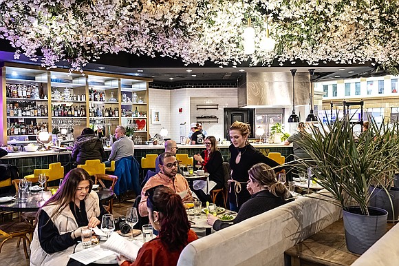 Americans pulled back on their spending last month after a surprisingly spendy January.