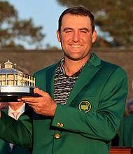 Scottie Scheffler earned the right to decide the menu for next year's Masters Champions Dinner. Scheffler poses with the Masters trophy during the Green Jacket Ceremony after winning the Masters at Augusta National Golf Club in April, 2022.
Mandatory Credit:	David Cannon/Getty Images