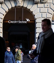 People walk near the logo of the Swiss bank Credit Suisse in Zurich, Switzerland March 20, 2023.
Mandatory Credit:	Denis Balibouse/Reuters