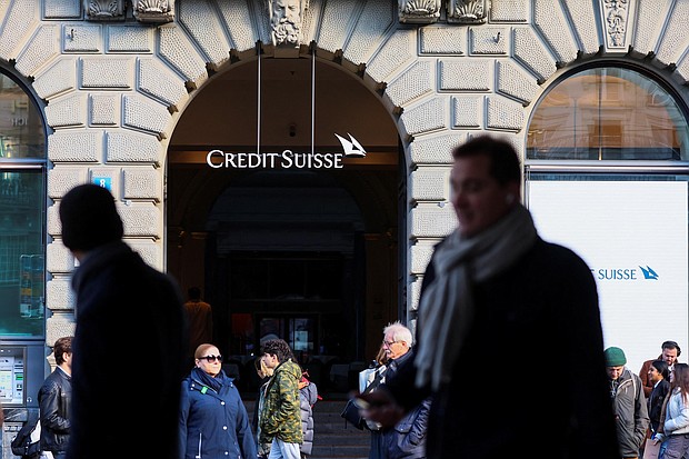 People walk near the logo of the Swiss bank Credit Suisse in Zurich, Switzerland March 20, 2023.
Mandatory Credit:	Denis Balibouse/Reuters