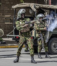 A Kenyan police officer fires tear gas at protesters in Nairobi, Kenya, on Monday.
Mandatory Credit:	Luis Tato/AFP/Getty Images