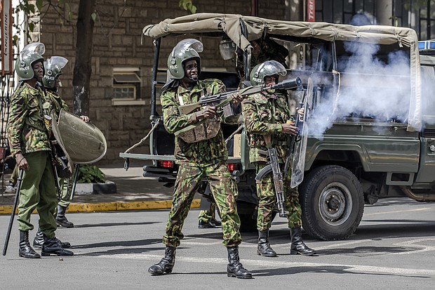 A Kenyan police officer fires tear gas at protesters in Nairobi, Kenya, on Monday.
Mandatory Credit:	Luis Tato/AFP/Getty Images