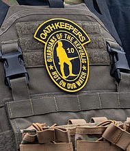 A member of the right-wing group Oath Keepers stands guard during a rally in front of the U.S. Supreme Court Building on January 5, 2021 in Washington, DC.
Mandatory Credit:	Robert Nickelsberg/Getty Images