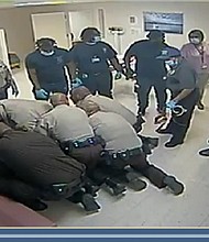 Surveillance video shows Irvo Otieno being pinned to the floor by multiple security officers at a Virginia state mental health facility in the moments leading up to his death earlier this month.
Mandatory Credit:	Dinwiddie County Commonwealth's Attorney
