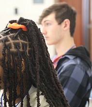 Charis Harrell, 16, a junior at Midlothian High School, left, and James Rioux 16, a junior at Clover Hill High School in Midlothian listen to a speaker Saturday, March 18, during the inaugural Teen Summit RVA at the Greater Richmond Convention Center.