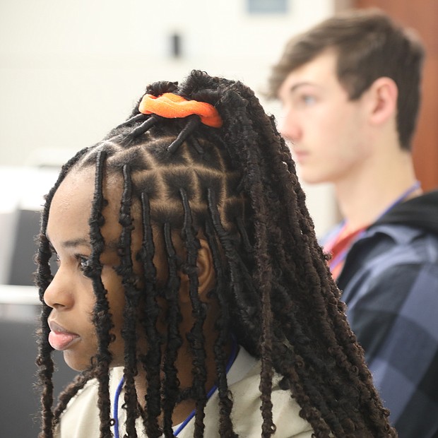 Charis Harrell, 16, a junior at Midlothian High School, left, and James Rioux 16, a junior at Clover Hill High School in Midlothian listen to a speaker Saturday, March 18, during the inaugural Teen Summit RVA at the Greater Richmond Convention Center.