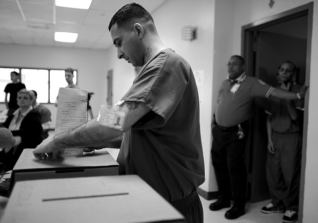 Prison inmate casts his ballot, as prisoners voted two days early in the Democratic primary, at Correctional Institute 501, in Bayamon, Puerto Rico, on May 30, 2008.Brennan Linsley / AP file