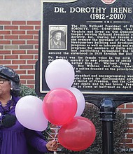 The 111th birthday of Richmond native and civil rights legend Dorothy Irene Height was celebrated Friday, March 24, at the Hull Street Branch Library on Richmond’s South Side and not far from where Dr. Height was born. Standing in front of a historic marker that honors Dr. Height is Barbara Crump of Glen Allen, a National Council of Negro Women member. Dr. Height was president of the NCNW for 40 years.