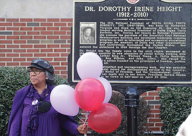 The 111th birthday of Richmond native and civil rights legend Dorothy Irene Height was celebrated Friday, March 24, at the Hull Street Branch Library on Richmond’s South Side and not far from where Dr. Height was born. Standing in front of a historic marker that honors Dr. Height is Barbara Crump of Glen Allen, a National Council of Negro Women member. Dr. Height was president of the NCNW for 40 years.