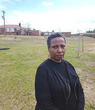 The Rev. Monica Esparza stands on land at Hickory Hill Community Center where the city Fire Department wants to build a new fire training facility. She is among the opponents who want to keep the space green and undisturbed.