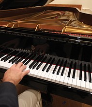 A close-up view of the Steinway Spirio Player Piano Model D.