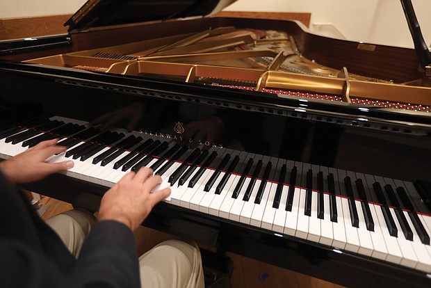 A close-up view of the Steinway Spirio Player Piano Model D.