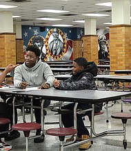 Izay’a Roane, 11, and Raymond Allen, 15, both enrolled at Franklin Military School, gave their full attention to the men who led the educational program that is designed to help young boys become well-rounded young Black men. Concerned Black Men was formed in 1986.