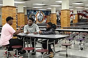 Izay’a Roane, 11, and Raymond Allen, 15, both enrolled at Franklin Military School, gave their full attention to the men who led the educational program that is designed to help young boys become well-rounded young Black men. Concerned Black Men was formed in 1986.