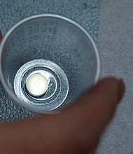 A patient prepares to take mifepristone, the first pill given in a medical abortion, at Women's Reproductive Clinic of New Mexico in Santa Teresa, January 13.
Mandatory Credit:	Evelyn Hockstein/Reuters/File