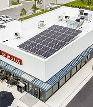The exterior of a new Chipotle has solar panels.
Mandatory Credit:	Chipotle