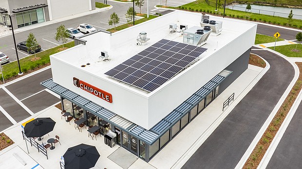 The exterior of a new Chipotle has solar panels.
Mandatory Credit:	Chipotle
