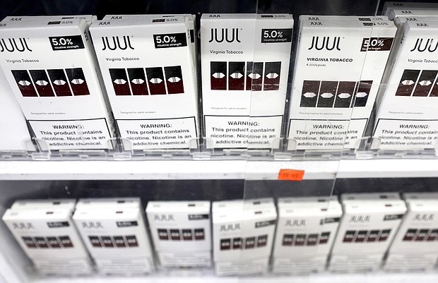 Juul Labs is paying $462 million to six US states and DC in the largest multi-state settlement yet for the troubled company. Juul e-cigarettes are displayed here for sale in 2022 in Los Angeles.
Mandatory Credit:	Mario Tama/Getty Images