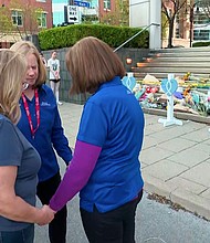 People gather Tuesday to grieve the five people killed inside a bank, in Louisville, Kentucky.
Mandatory Credit:	CNN