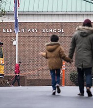 Students return to Richneck Elementary on Jan. 30, 2023, in Newport News, Va. A grand jury has indicted the mother of a 6-year-old boy who shot his teacher on charges of child neglect and failing to secure her handgun in the family’s home, a prosecutor said Monday.