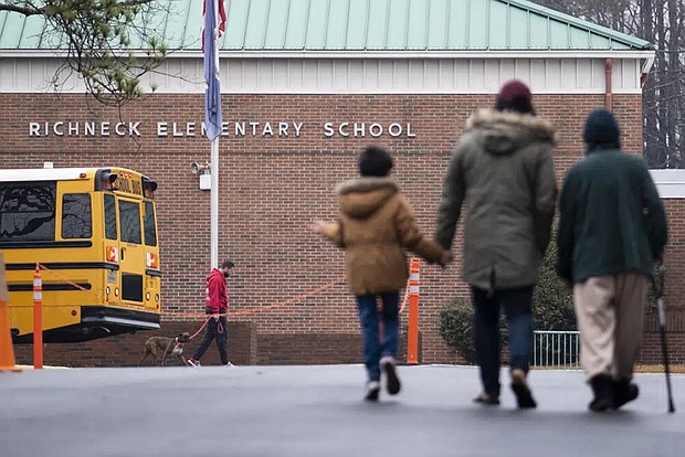 Students return to Richneck Elementary on Jan. 30, 2023, in Newport News, Va. A grand jury has indicted the mother of a 6-year-old boy who shot his teacher on charges of child neglect and failing to secure her handgun in the family’s home, a prosecutor said Monday.