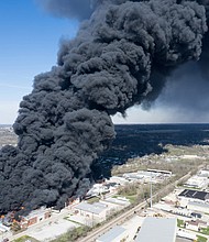 A large fire burns at a recycling facility in Richmond, Indiana, on Tuesday.
Mandatory Credit:	Kevin Shook/Global Media Enterprise