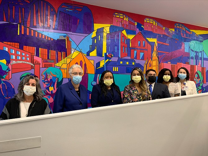 Cook County President Toni Preckwinkle, with Cook County Commissioners Donna Miller and Monica Gordon, at the unveiling of a mural created by artist Lorelei Pement at Blue Island Health Center. Photo provided by Cook County Health.