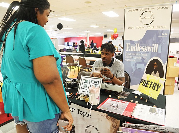William Davis, a poet based in Grand Rapids, Mich., reads a poem for Andrea Byrd of Richmond during the African-American Book Festival presented by the Virginia Business Expo at Richmond Diversity Center Saturday on April 15.