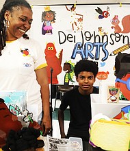 Deidra Johnson, a children’s book illustrator and author, participates in the African-American Book Festival with her son, Josiah Johnson, 13, who was on hand to assist her. The April 15 festival was presented by the Virginia Business Expo at Richmond Diversity Center, 1407 Sherwood Ave.