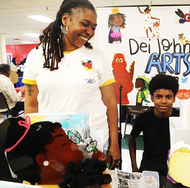 Deidra Johnson, a children’s book illustrator and author, participates in the African-American Book Festival with her son, Josiah Johnson, 13, who was on hand to assist her. The April 15 festival was presented by the Virginia Business Expo at Richmond Diversity Center, 1407 Sherwood Ave.