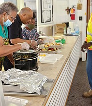 Elaine Miller, Luther A. Brown Jr. and Josephine S. Myers on the serving line at Swansboro Baptist Church on Midlothian Turnpike.