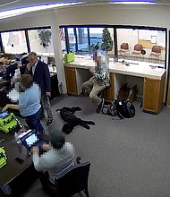 Newly obtained surveillance video shows a Republican county official and a team of operatives working for Trump 2020 attorney Sidney Powell inside a restricted area of the elections office in Coffee County Georgia. Portions of this image were obscured to protect the identity of people unnamed in the report.
Mandatory Credit:	Coffee County