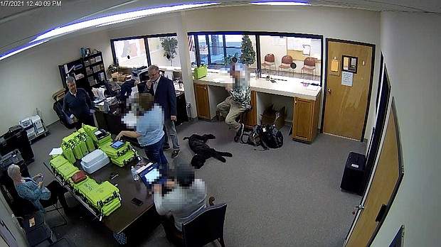 Newly obtained surveillance video shows a Republican county official and a team of operatives working for Trump 2020 attorney Sidney Powell inside a restricted area of the elections office in Coffee County Georgia. Portions of this image were obscured to protect the identity of people unnamed in the report.
Mandatory Credit:	Coffee County