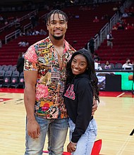 Simone Biles and Jonathan Owens attend a game between the Houston Rockets and the Los Angeles Lakers on December 28, 2021, in Houston, Texas. Biles and NFL player Jonathan Owens are now married.
Mandatory Credit:	Carmen Mandato/Getty Images/FILE