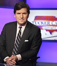 Fox News and Tucker Carlson, the right-wing personality who hosted the network's highly rated 8pm hour, have severed ties, the network said in a stunning announcement on April 24.
Mandatory Credit:	Richard Drew/AP