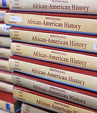 Books are piled up in the classroom for students taking AP African-American Studies at Overland High School on November 1, 2022 in Aurora, Colorado.
Mandatory Credit:	RJ Sangosti/MediaNews Group/The Denver Post/Getty Images