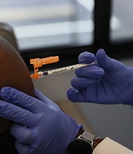 Florida Surgeon General Dr. Joseph Ladapo altered a government analysis last year to suggest mRNA Covid-19 vaccines pose a significant health risk to men ages 18 to 39, Politico reported Monday.
Mandatory Credit:	Joe Raedle/Getty Images