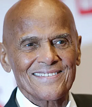 Harry Belafonte arrives at a charity gala in Berlin on Dec. 6, 2014. Belafonte starred on the stage and screen while lending his voice to a number of social justice and environmental causes. (Steffi Loos/The Associated Press)