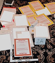 This image contained in a court filing by the Department of Justice on August 30, 2022, and partially redacted by the source, shows a photo of documents seized during the August 8th FBI search of former President Donald Trump's Mar-a-Lago estate.
Mandatory Credit:	Department of Justice