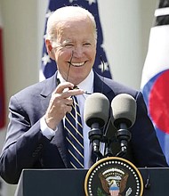 President Biden takes off his sunglasses at a news conference with South Korea’s President Yoon Suk Yeol on Wednesday in the Rose Garden of the White House.