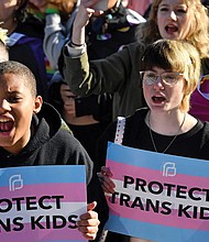 Protesters of Kentucky Senate bill SB150, known as the Transgender Health Bill, cheer on speakers March 29 during a rally on the lawn of the State Capitol in Frankfort, Ky.