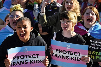 Protesters of Kentucky Senate bill SB150, known as the Transgender Health Bill, cheer on speakers March 29 during a rally on the lawn of the State Capitol in Frankfort, Ky.