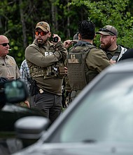 Law enforcement search for the suspect a few miles from the scene where five people, including an 8-year-old child, were killed after a shooting inside a home on April 29, 2023 in Cleveland, Texas.
Mandatory Credit:	Go Nakamura/Getty Images