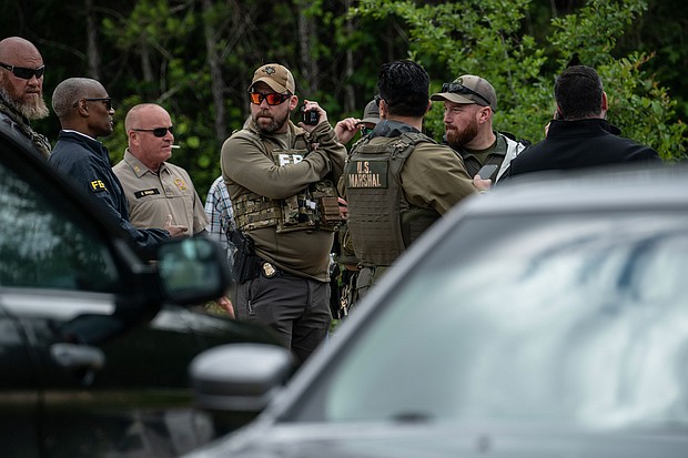 Law enforcement search for the suspect a few miles from the scene where five people, including an 8-year-old child, were killed after a shooting inside a home on April 29, 2023 in Cleveland, Texas.
Mandatory Credit:	Go Nakamura/Getty Images