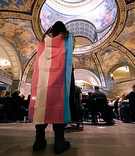 Glenda Starke wears a transgender flag as a counterprotest during a rally in favor of a ban on gender-affirming health care legislation on March 20, at the Missouri Statehouse in Jefferson City, Missouri.
Mandatory Credit:	Charlie Riedel/AP
