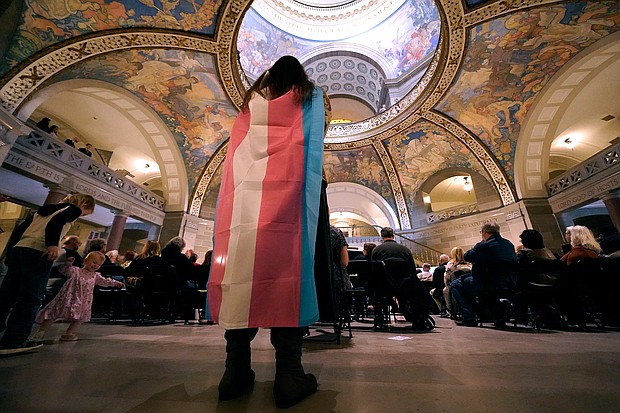 Glenda Starke wears a transgender flag as a counterprotest during a rally in favor of a ban on gender-affirming health care legislation on March 20, at the Missouri Statehouse in Jefferson City, Missouri.
Mandatory Credit:	Charlie Riedel/AP